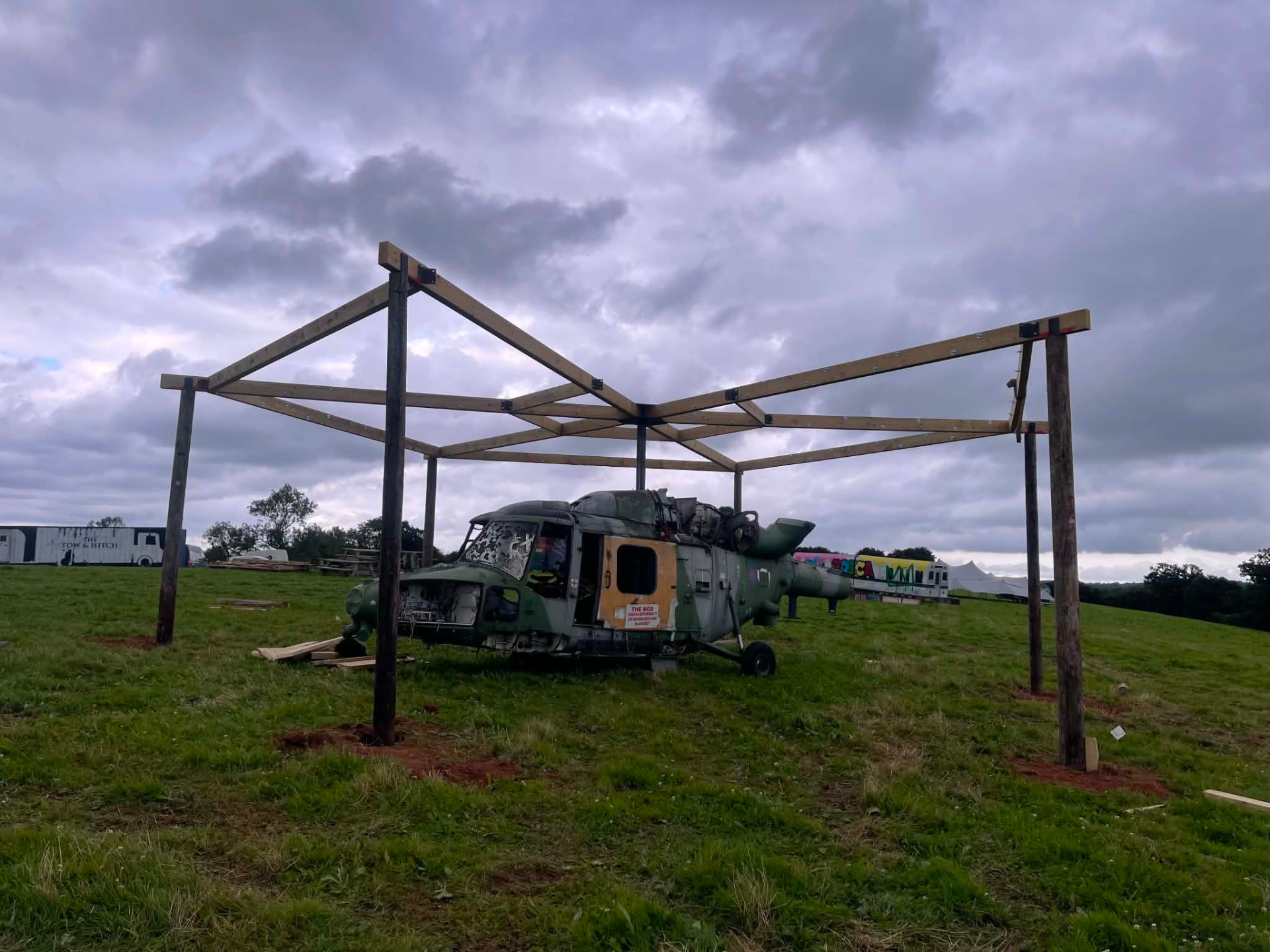Timber structure raised around the helicopter fuselage