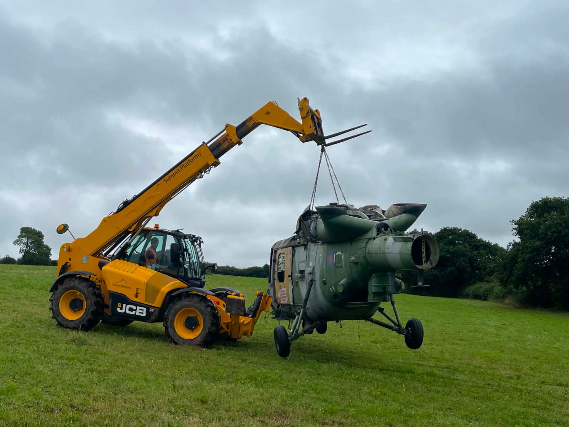 Telehandler lifting the helicopter fuselage into position