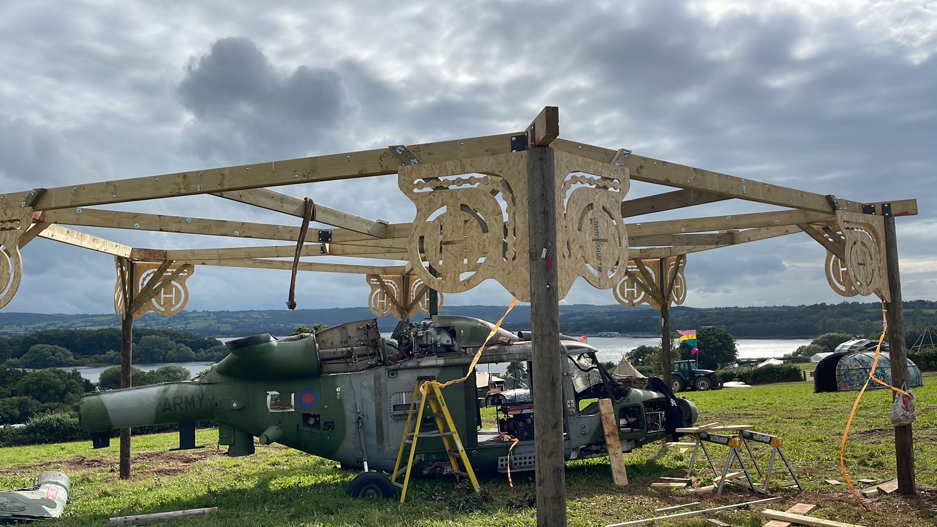 CNC-cut plywood brackets fixed to the timber canopy