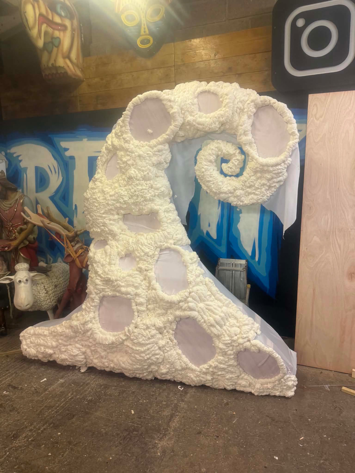 Hand-carved foam scenic element in progress in the workshop